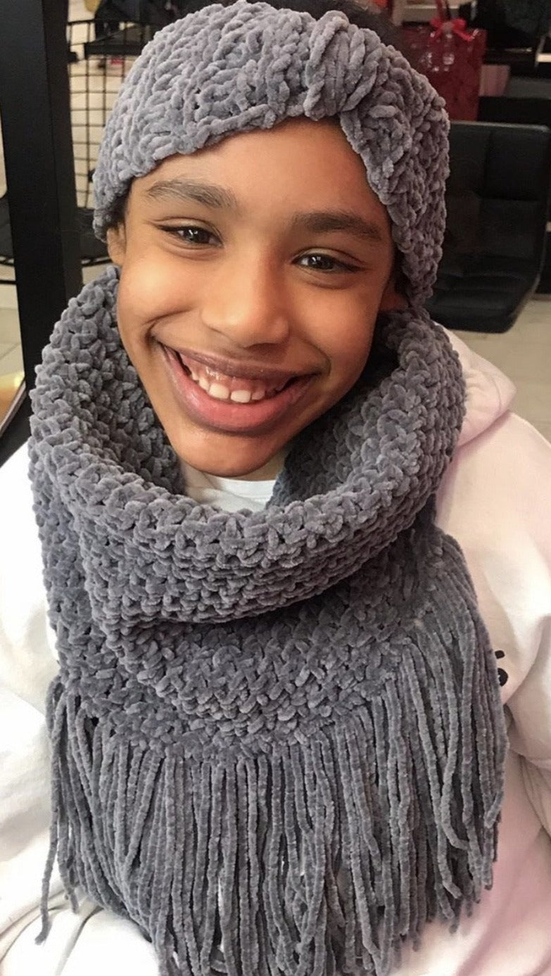 grey handmade crochet fringed cowl with matching headband.
